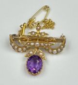 A 9ct gold brooch with amethyst and seed pearl decoration, with safety chain and approximate