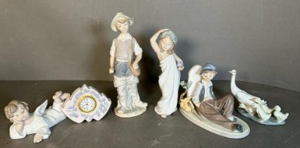 A selection of five Lladro figures and a Lladro clock