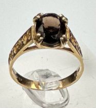 A 9ct gold and smokey quartz ring with ornate shoulders, approximate size K 1/2