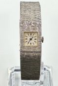 A 1970's bark effect silver watch by Tiara, 17 Jewels incabloc