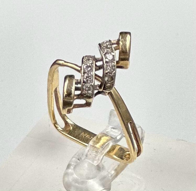 A 14ct gold diamond and gold ring in the form of a stirrup, approximate weight 3.1g