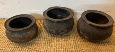 A set of three pottery cooking pots, Sandy ware medieval style possibly terracotta (H16cm Dia21cm)