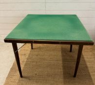 A folding games table with green baize top (83cm x 83cm)