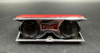 A pair of vintage Rand collapsible opera glasses