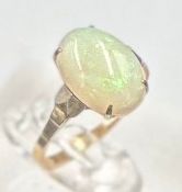 A 9ct gold ring with opal central stone, approximate size K.