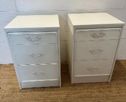 A pair of white bedside tables with Louis style handles (H69cm W44cm D42cm)