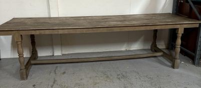 A large farm house refectory table on turned legs with cross stretchers (H80cm W309cm D100cm)