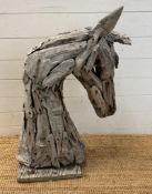 A driftwood garden sculpture of a horse head (H86cm)