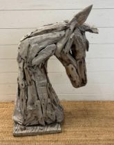 A driftwood garden sculpture of a horse head (H86cm)