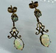 A pair of 9ct gold opal drop earrings