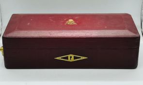 A red Morocco leather dispatch box with brass Royal insignia of King George V and numbered 36 with