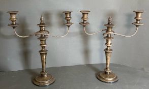 A pair of Garrard & Co three light silverplated candlesticks.