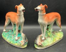 A pair of 19th Century Staffordshire hunting dogs (H18cm)