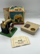 A metal tin steam engine