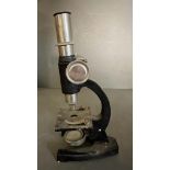 A vintage boxed SEL microscope with glass slides