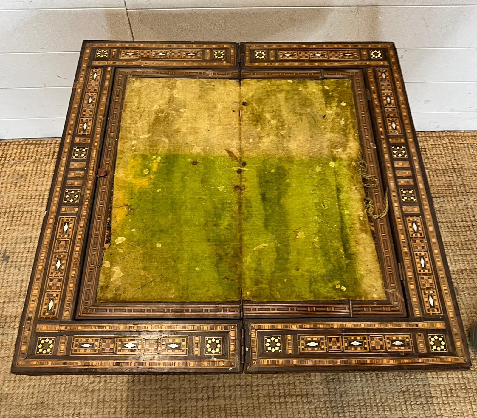 A marquetry inlaid games table with playing surface, back gammon, chess board etc , Damasais or - Image 5 of 9