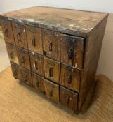 A fifteen drawer turn of the century haberdashers cabinet (H92cm W100cm D67cm)