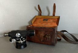 A Theodolite by E.R.Watts and Sons Ltd in a A Clarkson and Co brown leather case with tripod and