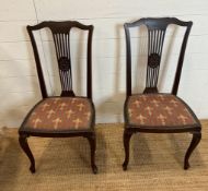 Two mahogany slat back Edwardian style chairs