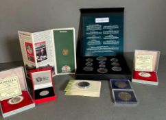 A selection of collectable coins to include: Bradford Exchange Coronation coin and stamp set,