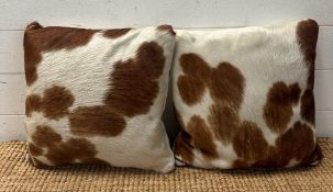 Two cow hide cushions in tan and white 38 x 38