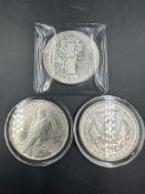 A selection of three American dollar coins to include: One Ounce Liberty silver coin, 1889 Liberty