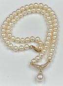 A pearl necklace with 9ct gold clasp and setting for single pearl pendant