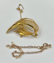 A 9ct gold brooch along with a fine 9ct gold bracelet with a combine approximate weight of 7.3g