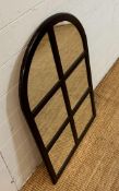 A contemporary arched hall mirror comprising of six mirrored panels in a black frame 92cm x 60cm