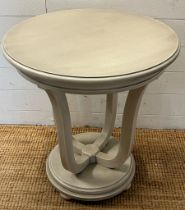 A side table with four supporting legs on circular base by Wychwood Design (H66cm Dia60cm)