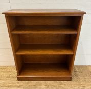 A wooden two shelf free standing bookcase (H92cm)
