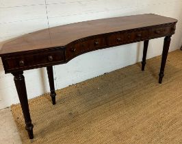A mahogany carved console table with four drawers on fluted legs (H80cm W176cm D38cm)