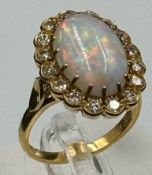An 18ct Opal and diamond ring, approximate size N 1/2