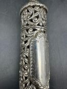 A Filigree and pierced silver scroll holder, approximately 16cm long