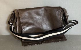 A brown leather Bally Satchel bag with black and white striped canvas shoulder strap