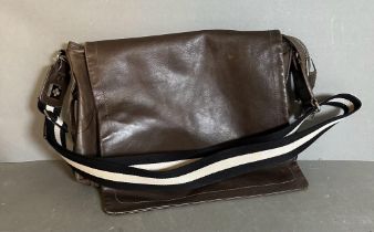 A brown leather Bally Satchel bag with black and white striped canvas shoulder strap