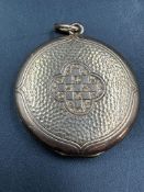 A 9ct gold locket, oval with brass fittings, approximate total weight 6.2g.