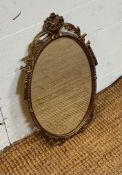 A metal gold painted mirror in the Rococo style 50cm x 27cm