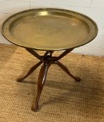 A brass tray table on tri pod stand with carved animals head ends (H50cm Dia60cm)