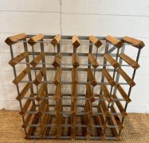 A wooden thirty six bottle wine rack