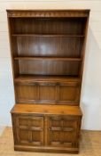 A Mid Century dresser comprising of two door cupboard and a pull down drinks bar (H195cm W97cm