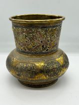 An Islamic vase, the brass vessel is inlaid with copper and Arabic calligraphy (H17cm Dia15cm)