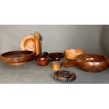 A selection of treen to include bowls, plate and sculpture