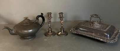 A selection of mixed metal items, a serving dish, two candlesticks and a pewter tea pot
