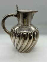 A silver pitcher (390g) by William Hutton & Sons (Edward Hutton) hallmarked for London 1889.