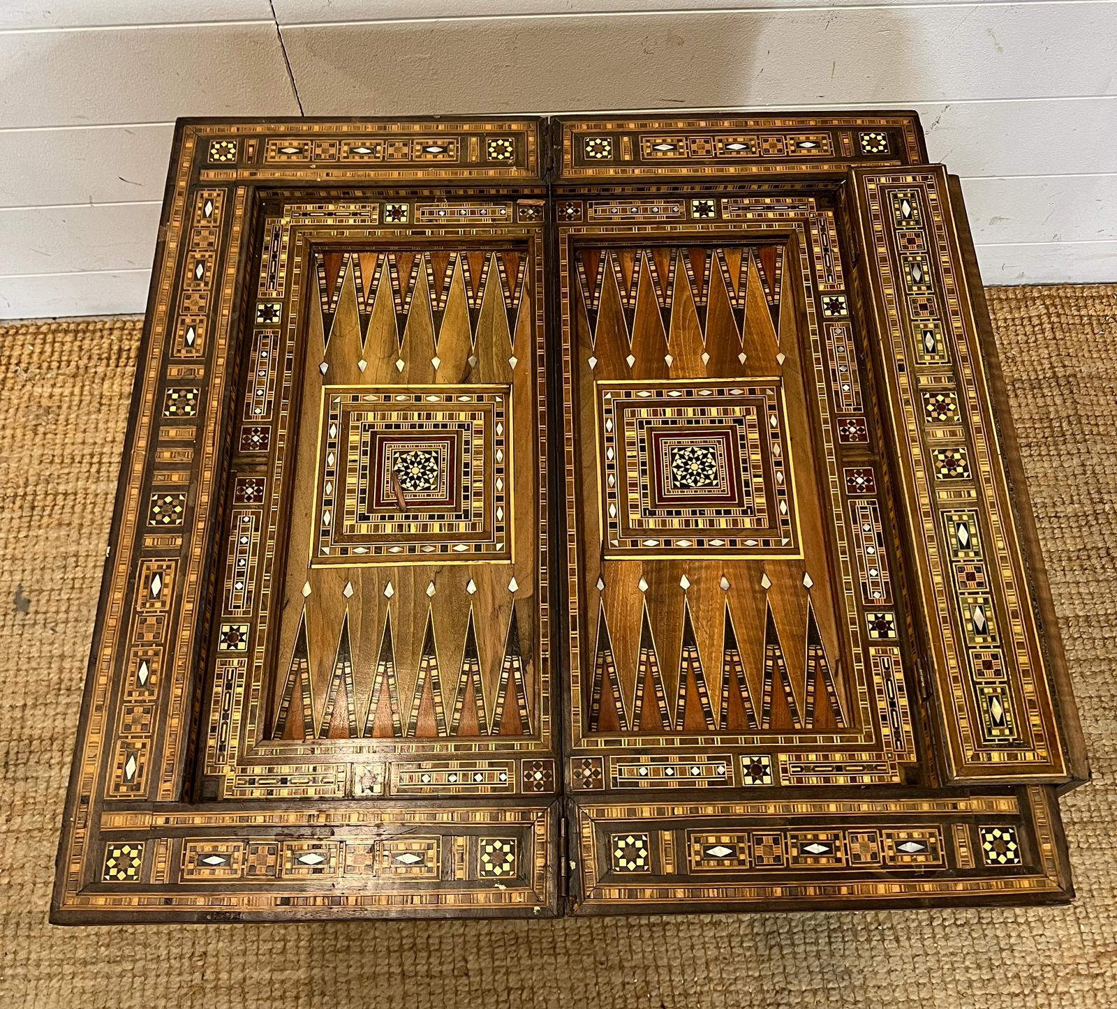 A marquetry inlaid games table with playing surface, back gammon, chess board etc , Damasais or - Image 9 of 9