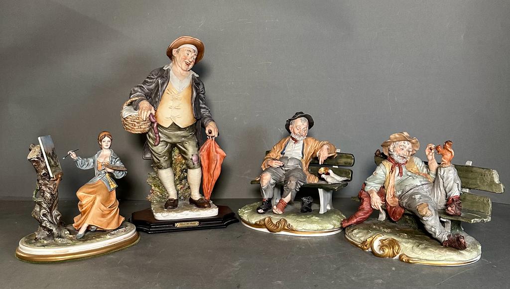 A selection of four Capodimonte figures to include Gentleman on benches, a man with a basket and a