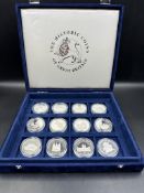 Twelve collectable silver coins celebrating the lif of the Queen Mother