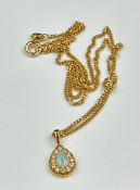 An 18ct yellow gold fine necklace with opal and diamond pendant, approximate weight 4.8g