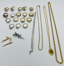 A selection of costume jewellery to include a wide range of white stone fashion rings, a silver line